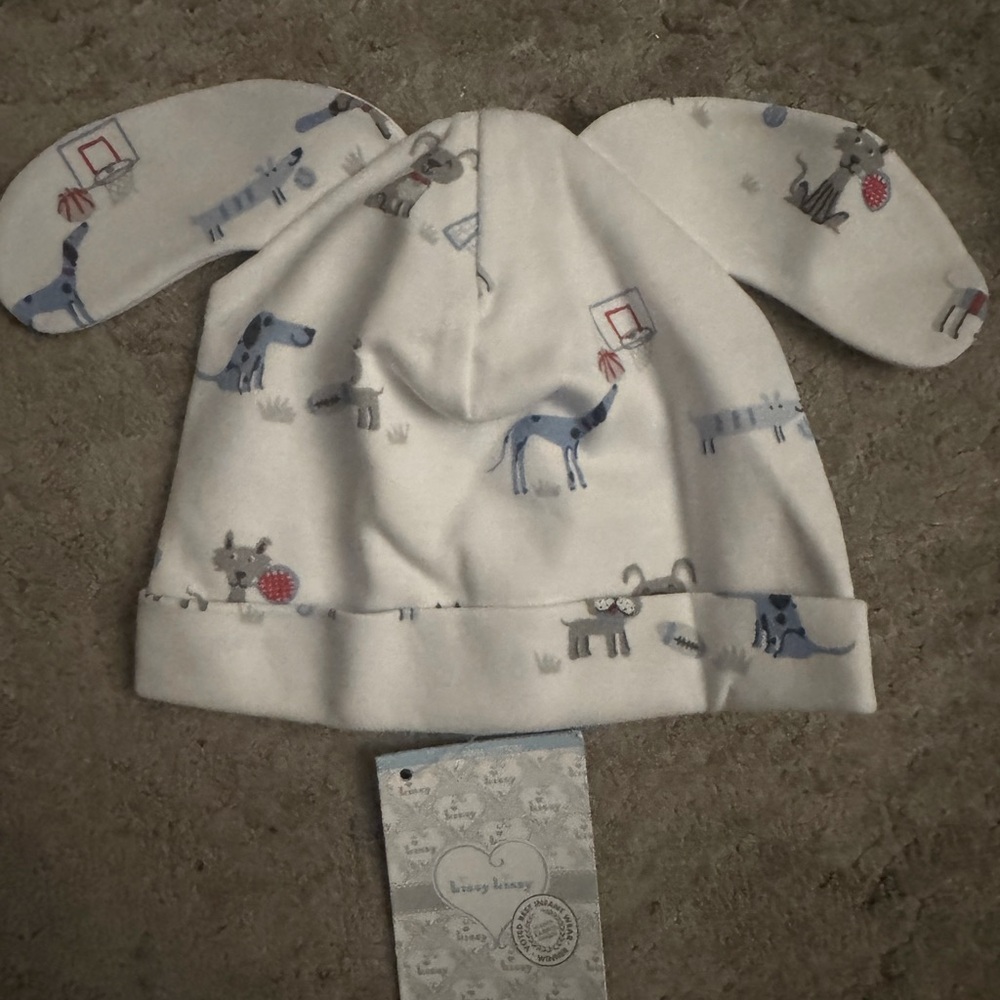 NWT kissy kissy baby hat. “Sporty pups”